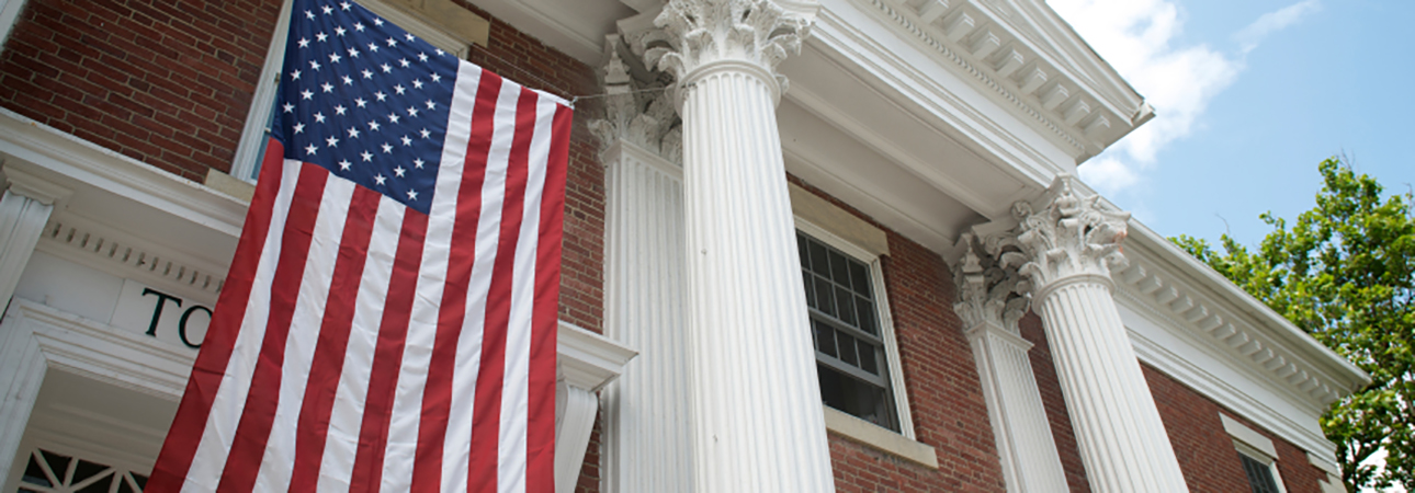 town hall with american flag